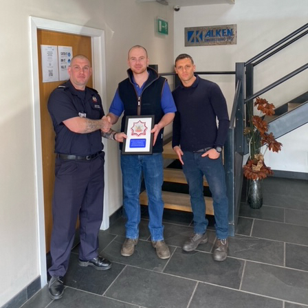 On-Call Firefighter CM Chris Prodromis with plaque presented to employer Alken Engineering Limited